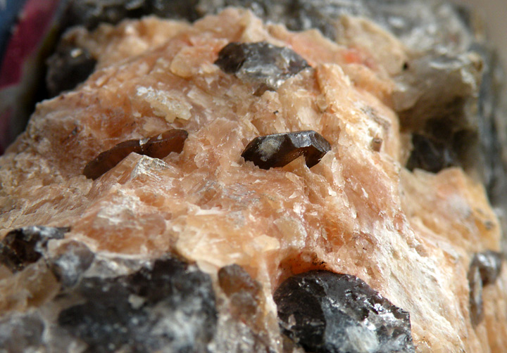 Smokey quartz in felspar, floating crystals are 1 to 1.5 cm.